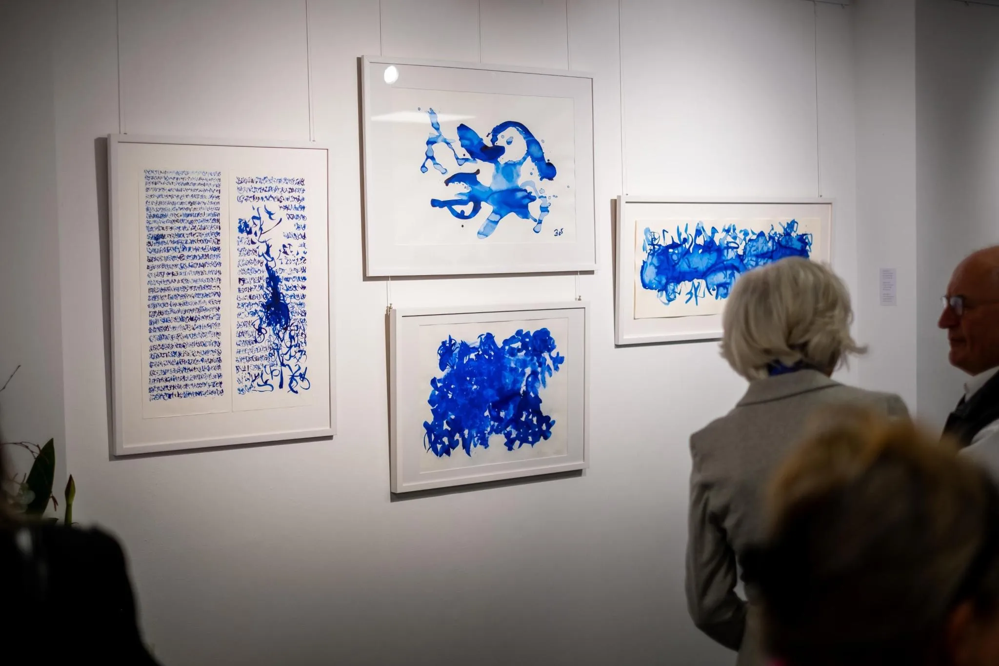 Gallery wall with blue ink works